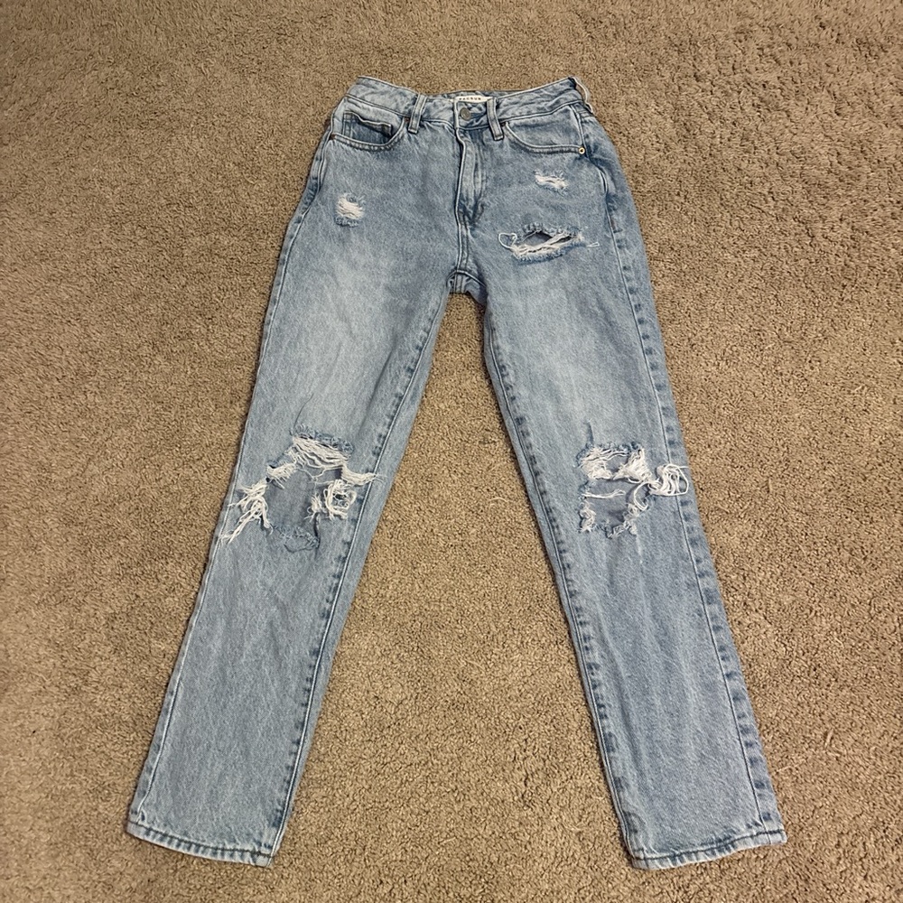 High-waisted blue distressed mom jeans